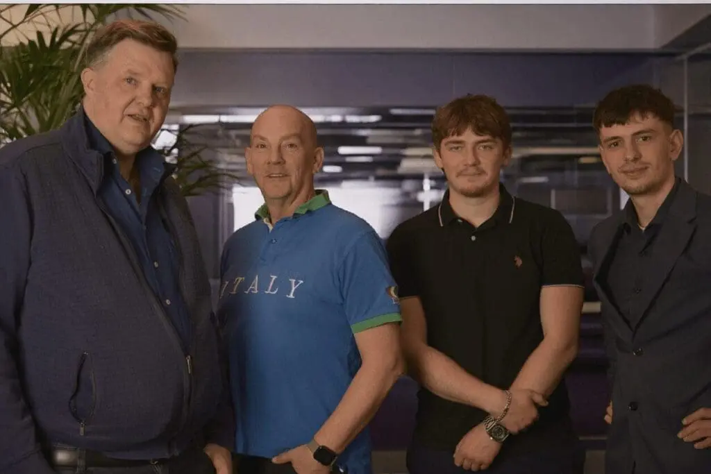 Ploko team photo: Erik Plomp, Frank Korlas, Gracjan Kaczmarzyk and Giovanni Pira stand side by side and look into the camera.